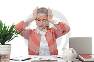 Businesswoman working at office desk is having an headache