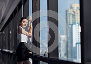 Businesswoman working in the office with looking out of the window