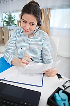 businesswoman working on phone from home