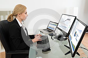 Businesswoman Working With Statistics Data On Computer