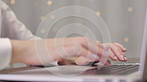 Businesswoman working on tablet computer.  Female hands type on laptop keyboard touching touchpad 4K