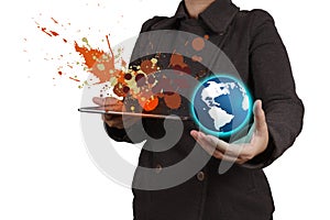 Businesswoman working with tablet computer showing the earth and