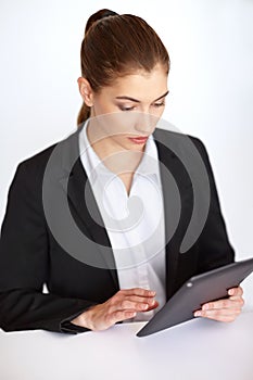 Businesswoman working at tablet pc