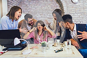 Businesswoman at workplace, ignoring work, not listening to annoying clients or bothering colleagues talking to her