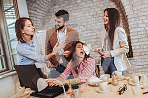 Businesswoman at workplace, ignoring work, not listening to annoying clients or bothering colleagues talking to her