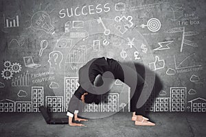 Businesswoman works with laptop in backbend pose