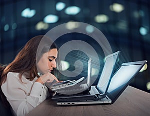 Businesswoman works with multiple devices, smartphone, calculator and laptops. Concept of overwork and stress