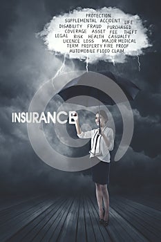 Businesswoman writing insurance text