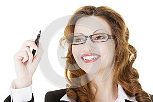 Businesswoman writing something on abstract screen