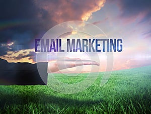 Businesswomans hand presenting the words email marketing