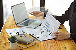 Businesswomen checking the financial data on spreadsheet