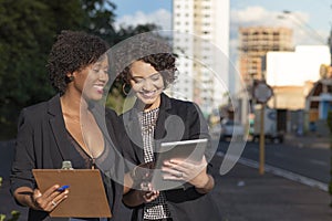 Businesswomen conducting conversation during meeting