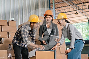 Businesswomen and factory employees meeting during stocktaking at the factory& x27;s