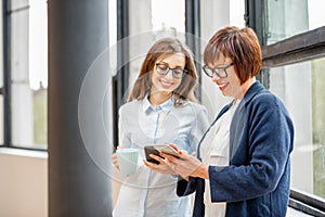 Businesswomen having a coffee break at the office