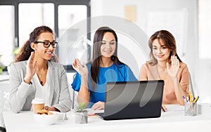 Businesswomen having video chat at office