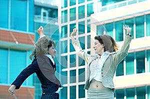 Businesswomen Jump For Joy Blue Tint