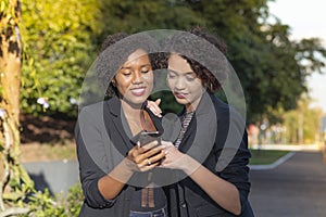 Businesswomen using cellphone resources