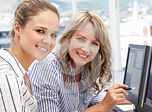 Businesswomen working on computers photo