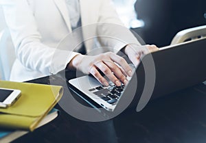 Businesswomen working in office, young hipster manager typing on keyboard, female hands texting message, work process concept