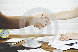 Busness man and woman shaking Hands