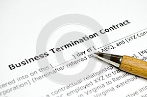 Bussines termination contract with wooden pen photo