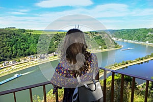 Woman resting, watching from the edge the abyss beneath photo