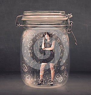 Bussines women trapped in jar with network symbols