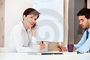 Bussiness people Using Cell Phones in a office photo