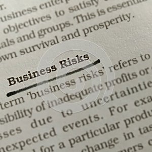 bussiness risks word presented on book matters underlined text form