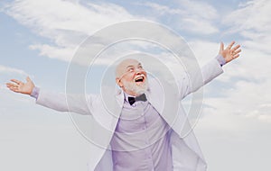 Bussiness success. Old senior mature man. Vintage successful male bussinessman in white suit having fun.