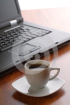 Bussiness theme with laptop and coffee photo