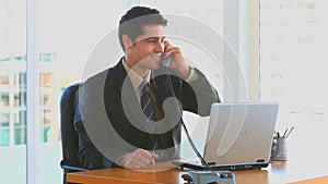 Bussinessman phoning in his office