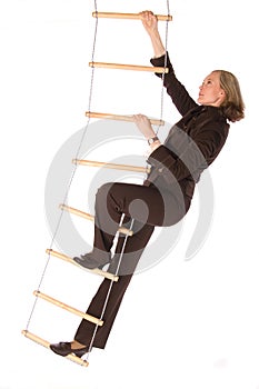 Bussinesswoman climbering the ladder of success