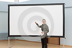 bussinesswoman points to a empty whiteboard