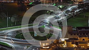 Bussy traffic on the road intersection in Dubai downtown aerial night timelapse, UAE