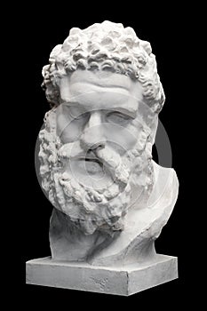 Bust of the Farnese Hercules. Heracles head sculpture, plaster copy of a marble statue on black. Son of Zeus