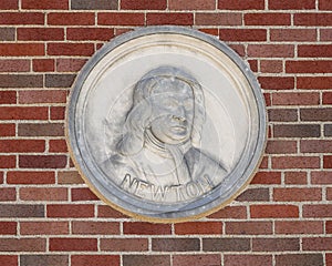 Bust portiRelief with Newton bust and quote on the outside wall of a building at Texas Woman`s University.