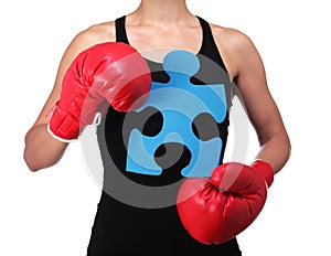 Bust of a woman boxer holding a puzzle piece