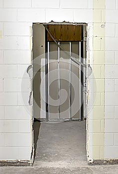 Busted Door In Concrete Wall