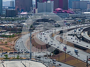 Bustling Las Vegas Cityscape with El Rio Hotel and Casino and Busy Highway Interchange on Sunny Day photo