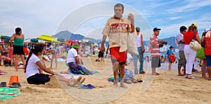 Bustling public beach in the middle of the weekday