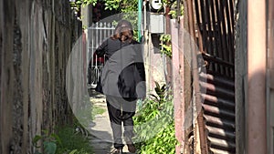 Busy Adult Female Walking On Pathway