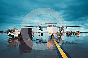 A busy airport in the rain