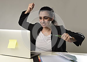 Busy attractive woman in business suit working in stress desperate overwhelmed