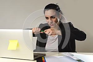 Busy attractive woman in business suit working in stress desperate overwhelmed