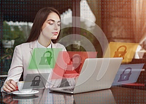 Busy business woman sitting at table in cafe, with cup of coffee and working on laptop