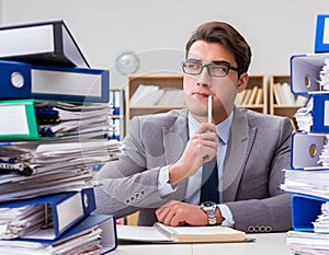 Busy businessman under stress due to excessive work