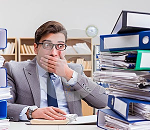 Busy businessman under stress due to excessive work