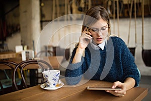 Busy businesswoman drinking coffee