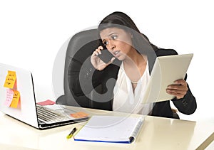 Busy businesswoman suffering stress working at office computer desk worried desperate